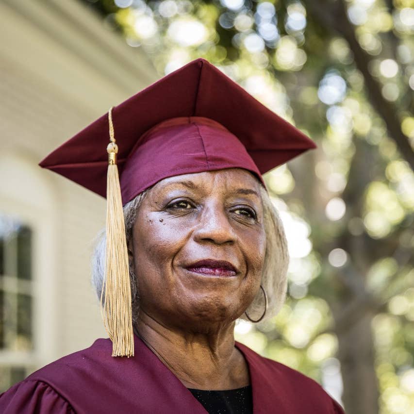 A headshot of an older student in graduation gear